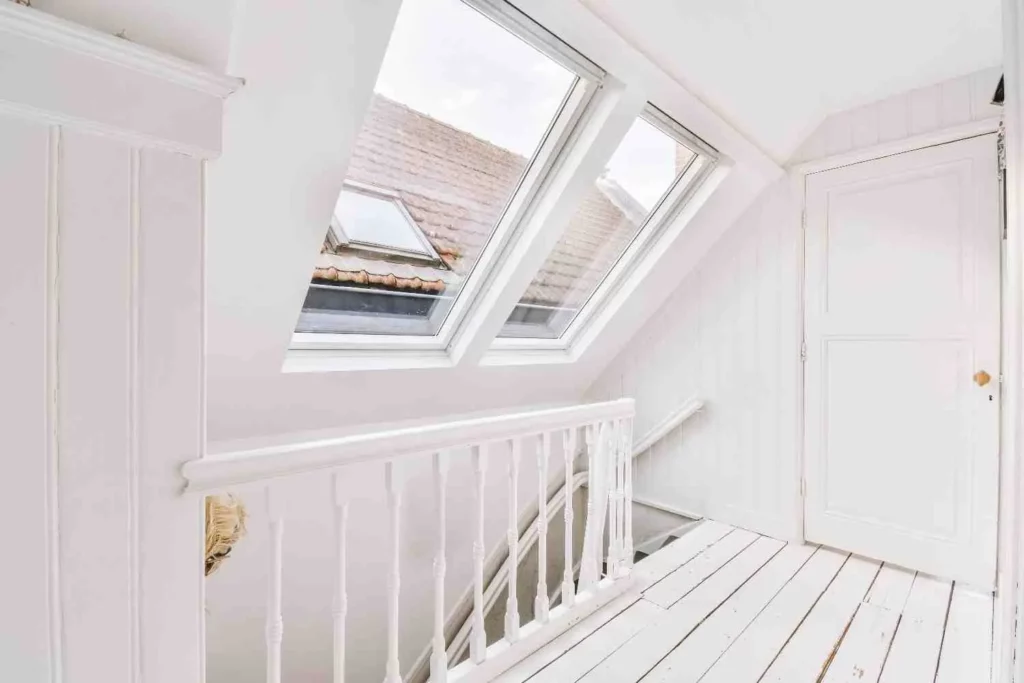 Bright modern loft conversion showing how much value does a loft conversion add to a home with extra living space and roof windows.
