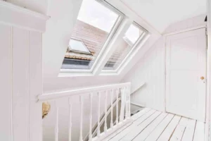 Bright modern loft conversion showing how much value does a loft conversion add to a home with extra living space and roof windows.