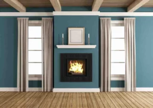 Framing a fireplace in a modern living room with a wood mantel, feature wall and contemporary fireplace surround during a home renovation project.