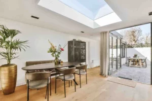 Modern Single Storey Rear Extension with a spacious dining area, large rooflight, bi-fold glass doors, Open-plan kitchen extension, elegant Rear extension design, functional Extension layout, and a contemporary Home extension project that maximises natural light and indoor-outdoor living.