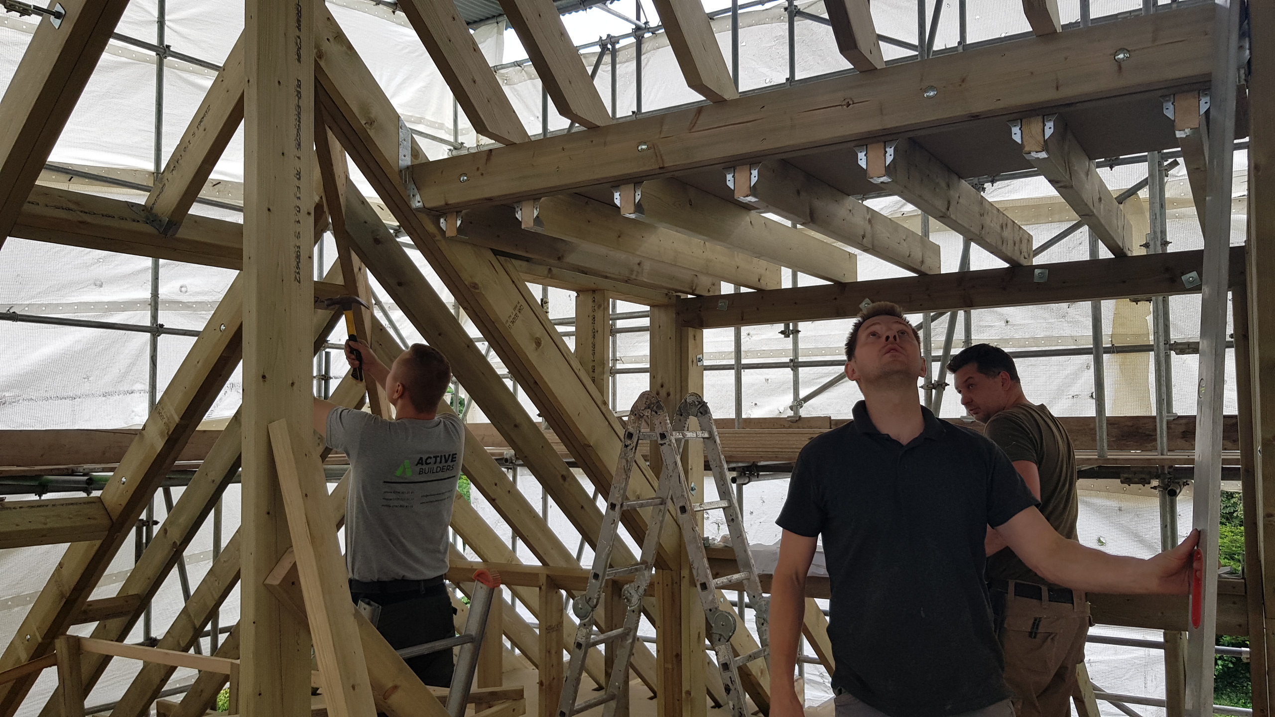 ABL Design & Build team reviewing renovation plans on site